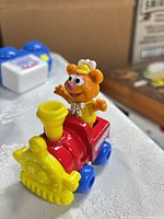 Angle view of Fozzie Bear plastic train toy