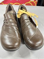 Front view of brown leather slip-on shoes