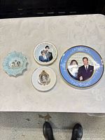 Group shot of four commemorative bone china pieces
