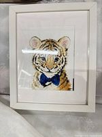 Front view showing tiger cub print, mat and white frame