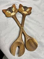 Pair of hand-carved wooden salad servers with cat head handles