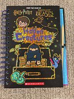 Front cover showing title, branding and glitter details