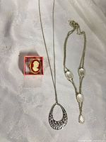 All three jewelry pieces laid out