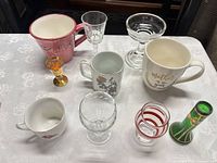 All ten glass and ceramic items displayed together on table