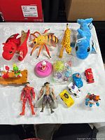 Group shot of all items including plush, action figures, vehicles and accessories