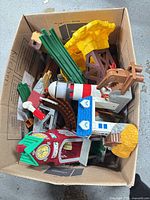 Box of assorted Fisher-Price GeoTrax pieces