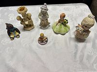 All six figurine candle holders displayed together
