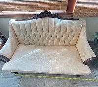 Front view of loveseat showing overall design and upholstery