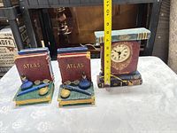 Set overview showing clock and both bookends with measuring tape for scale