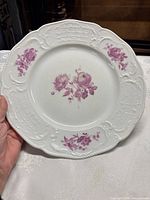 Front view showing floral decoration and embossed border