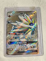 Front of Solgaleo-GX card in sleeve showing holographic artwork and text