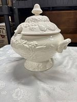 tureen with lid in place showing overall design and side handles