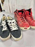 Two pairs of sneakers side by side showing overall appearance