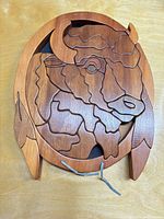 Front view of wooden buffalo puzzle wall art with detachable pieces