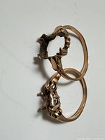 Two 10k gold ring settings front view
