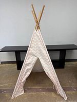 Full view of assembled pink and white chevron kids teepee tent