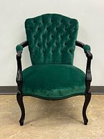 Full view of chair front showing upholstery, frame and legs