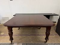 Full view of mahogany dining table top and legs