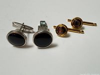 Cufflinks and shirt studs full group view
