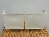 both wall sconces side by side showing fronts and tops