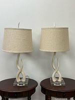 Pair of faux antler table lamps with shades on tables