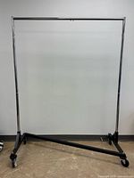 Full view of metal rolling clothing rack