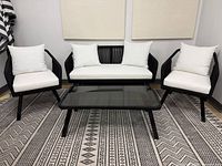 Front view of entire 4-piece patio set on rug