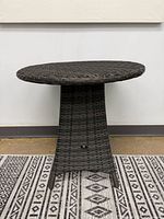Full view of round wicker end table