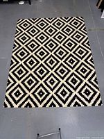 Full view of rectangular NuLOOM diamond rug on floor