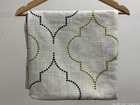 Front view of folded pillow cover showing pattern and texture