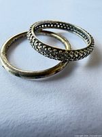 Two sterling silver eternity rings, top view