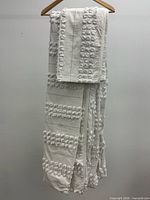 Set hanging to show overall appearance and texture