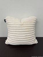 Front view of square ribbed faux fur pillow