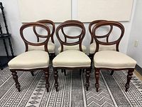 Front view of six mahogany balloon back chairs