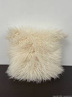 Front view of square white Mongolian lamb wool pillow
