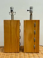 Front view of both wood block lamps showing cords and sockets