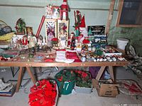 Main table loaded with assorted Christmas decorations