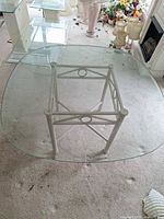 Overhead view of glass-top table and metal frame