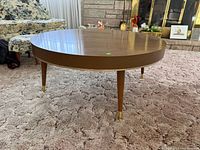 Full view of round coffee table on carpet