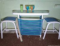 Front view of bar table, stools and cups