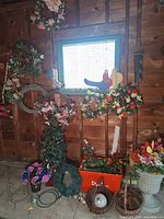 Overall view of wreaths, plaque, feeder, urn, tote and baskets