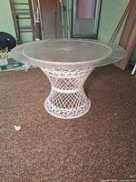 Side view showing wicker pedestal base and clear plastic top