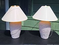 Front view of both matching pink ceramic lamps with shades