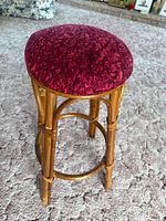 Full view of rattan barstool on carpet