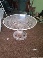 Full view of table showing lattice pedestal base and top