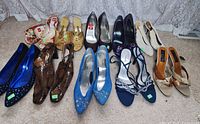 Group shot of eleven pairs of women’s dress shoes assorted styles and colours