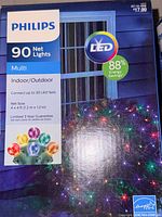 Close-up of Philips LED net lights box front showing specifications