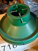 green plastic tree stand top view showing clamps