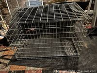 Overall view of wire dog crate with plastic base tray
