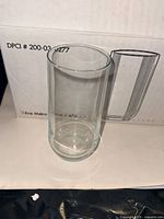 single tumbler in front of box